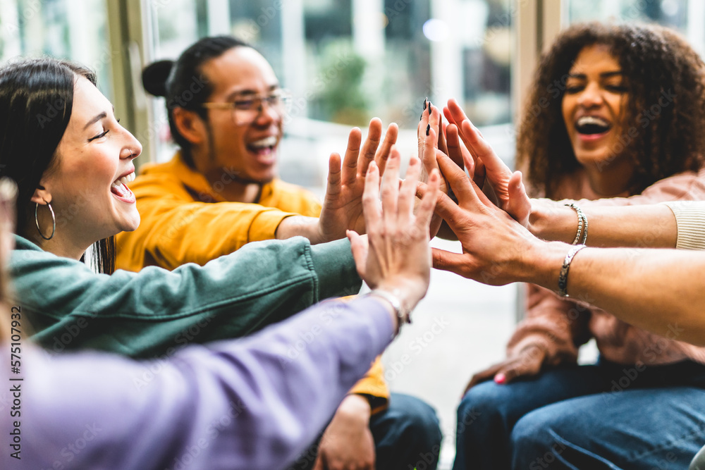 Team celebrating success with high-five